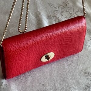 Two tone Coach wallet on a chain size 8x4 inches, Red& Fuschia color.6 card slot